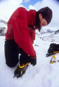 Fitting a crampon c.Alex Messenger