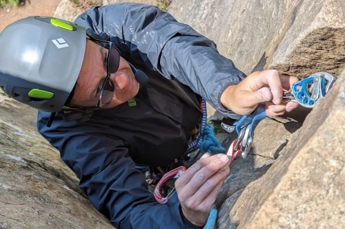 Michael removing a large blue cam while seconding